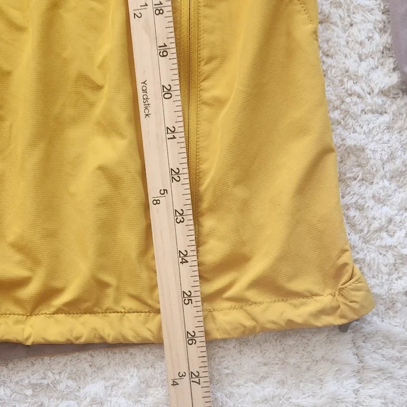 The North Face Flight SerieYellow and Gray Windbreaker.
